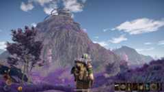 Outward - A player stands at the base of a purple mountain