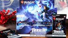 MTG Tarkir: Dragonstorm Play Booster box on a wooden table, with mist and cherry blossom in the background