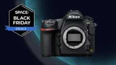 The Nikon D850 on a blue planet background with a black Space.com Black Friday deals badge in the upper left corner. 