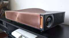 The Hisense L9Q UST projector in a living room
