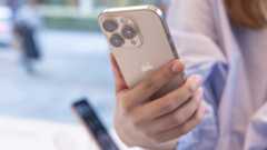 Woman holding an iPhone 