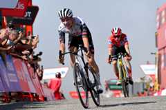 L'ANGLIRU, SPAIN - SEPTEMBER 05: (L-R) Joao Almeida of Portugal and UAE Team Emirates - XRG crosses the finish line as stage winner ahead of Jonas Vingegaard of Denmark and Team Visma | Lease a Bike - Red Leader Jersey during the La Vuelta - 80th Tour of Spain 2025, Stage 13 a 203.7km stage from Cabezon de la Sal to L'Angliru 1556m / #UCIWT / on September 05, 2025 in L'Angliru, Spain. (Photo by Tim de Waele/Getty Images)