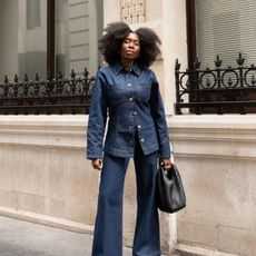 fashion influencer @daniellejinadu wearing a fitted-waist denim jacket