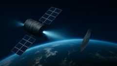 A rendering of a spacecraft moving a piece of space debris using an ion beam.