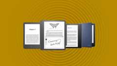 Four Amazon Kindle models on an orange background