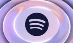 The Spotify logo in deep purple, surrounded by lilac rings to denote Lossless audio 