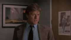 Robert Redford in a tan jacket and a blue shirt in Sneakers