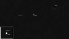 several white orbs on a black background