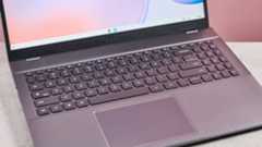 Close-up of keyboard on Acer Chromebook Plus 514, on desk with pink background