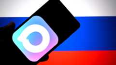 In this photo illustration, a MAX messenger app logo is seen displayed on a smartphone with a flag of Russia in the background.