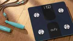 Eufy Smart Scale C1 on the floor beside skipping rope