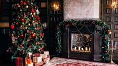 Country house decorated for Christmas, with decorated fireplace and Christmas tree