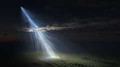 An illustration of streaks of light going from space onto an array of dots on the ground.
