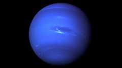 Deep blue Neptune against black backdrop of space.