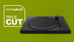 Sony PS-LX310BT turntable with green background and TR 'price cut' badge