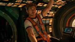 An astronaut inside the cockpit of a spaceship