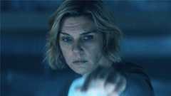 Carol lifting up a plastic sheet in a dark room in Pluribus episode 5