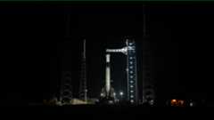 A SpaceX Falcon 9 rocket with the company&rsquo;s Dragon spacecraft on top stands vertical on the launch pad at Space Launch Complex 40 at Cape Canaveral Space Force Station in Florida on Friday, Feb. 13, 2026, ahead of NASA&rsquo;s SpaceX Crew-12 launch.