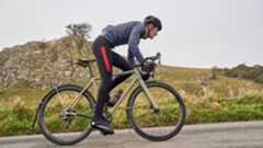 Male cyclist wearing cycling overshoes while on a winter road ride