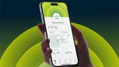 Hand holding mobile with ExpressVPN open at homepage. There is a dark background with green semi-circles