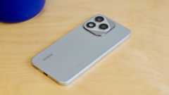 The Honor 400 Lite resting on a wooden table