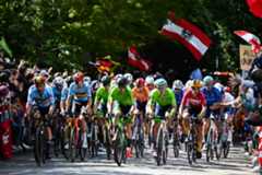 A general view of the peloton competing while fans cheers during the 97th UCI Cycling World Championships Zurich 2024 Men&#039;s Elite Road Race