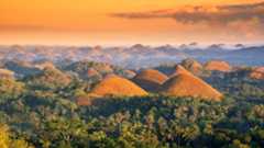 View of the Chocolate Hills at sunset.