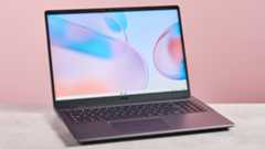 Acer Chromebook Plus 514 open on desk with pink background
