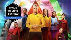 eight characters are standing front-on to the camera in different colored uniforms in front of a multi-colored background with the space.com logo in the top left corner.