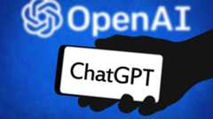 OpenAI logo with ChatGPT on phone