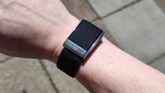 Whoop MG worn on man's wrist on street