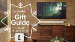 sonos arc soundbar mounted on wall beneath TV with Sonos sub and TechRadar gift guide logo