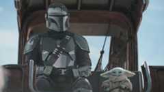 Din Djarin and Baby Yoda sitting together in the Super Bowl TV spot for The Mandalorian and Grogu