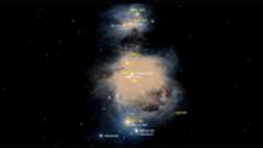 A glowing stream of light from the Orion Nebula is seen contrasted against the dark starry space background. Various labeled dots of stars are seen dispersed in yellow and white text throughout the nebula
