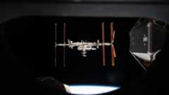 international space station seen through a spacecraft window