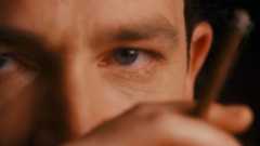 Close up of Bono with a cigar