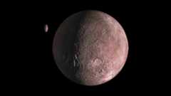 A small reddish rocky planet is seen in the darkness of space with a smaller planet-looking object nearby