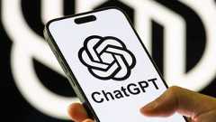 ChatGPT logo on iPhone in person's hand 