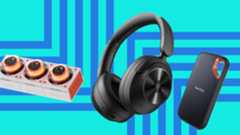 A Genki Moonbase charging station, OneOdio FOcus A6 headphones and a Sandisk Extreme SSD on a blue background