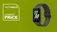 The Samsung Galaxy Fit 3 on a green background with text saying Lowest Price.