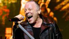 Bruce Dickinson singing onstage with Iron Maiden in 2025