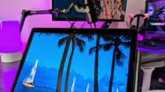 A close-up of the Lenovo ThinkPad X12 Detachable (Gen 2), showing the magnetically attached stylus, side-mounted speakers, and 5MP webcam with an IR sensor and physical privacy shutter.