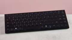 Razer Joro on desk with pink background