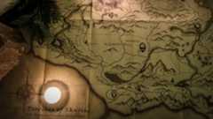 A close-up of a map being opened during the Elder Scrolls Skyrim. 