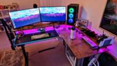 Fezibo Triple Motor L-Shaped Desk review image showing the desk with pink RGB lighting turned on
