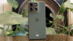 The Motorola Edge 70 perched on a brown table.