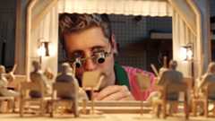 OpenAI CEO Sam Altman looking at models of an audience AI-generated using Sora 2