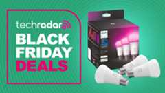 Philips Hue light bulbs on green background with text reading &#039;TechRadar Black Friday deals&#039;