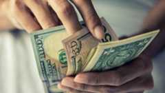 Close-up hands counting money American dollars