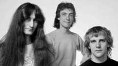 Rush posing for a photograph in 1980